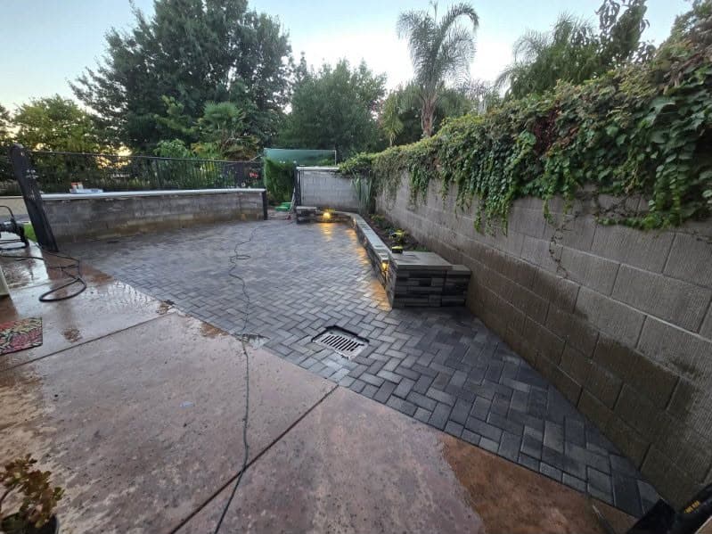 Backyard after paver patio installation with new landscape lighting in Sacramento CA